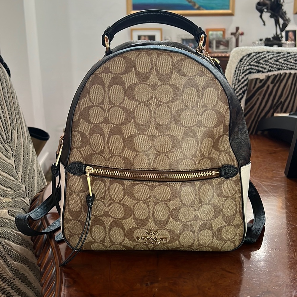 AUTHENTIC Coach monogram book bag - unisex- can be worn on wrist as well.